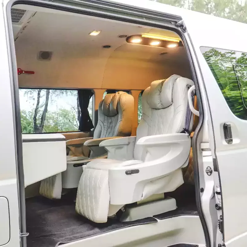 White Toyota HiAce Premio with the sliding door open