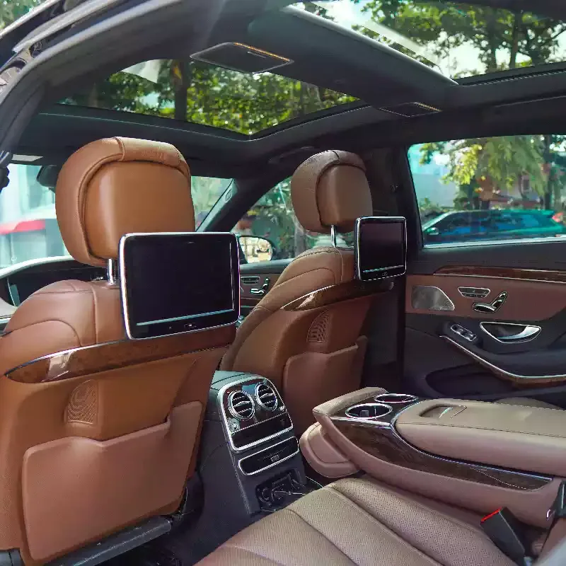 Rear cabin of a Mercedes-Benz S400 with tan leather seats