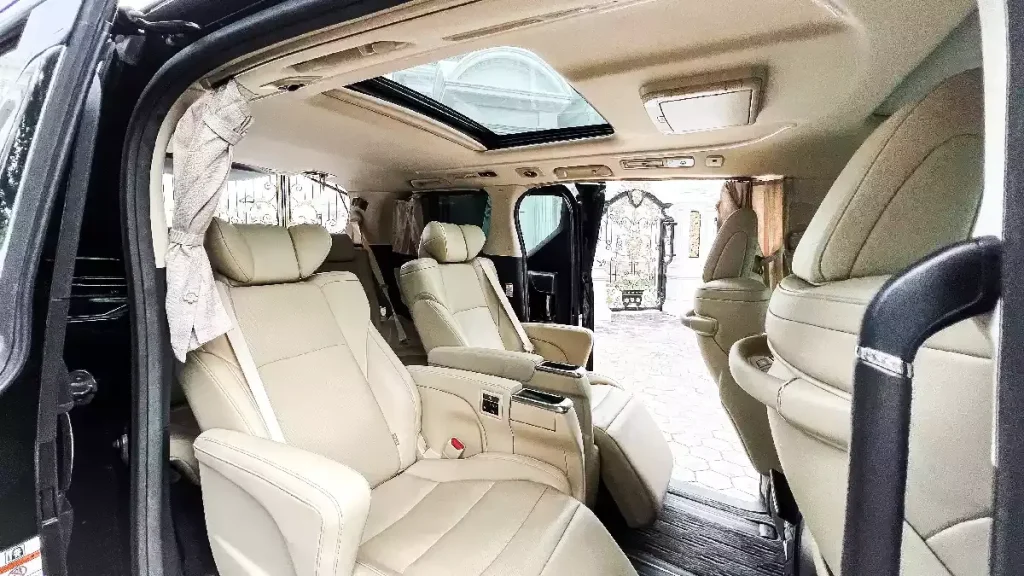 Alphard passenger cabin seen through the open sliding door
