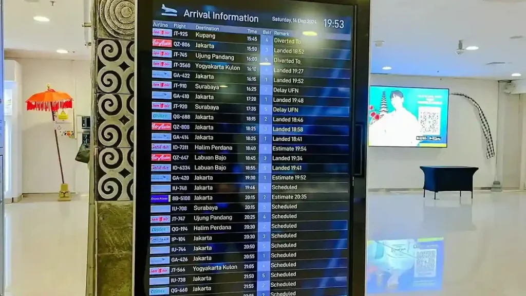 Arrival information flight board in the arrivals hall at Ngurah Rai Airport