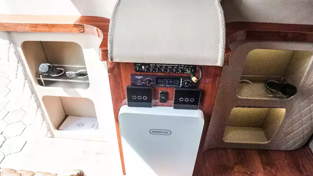 Interior of a Toyota HiAce with refrigerator and audio system